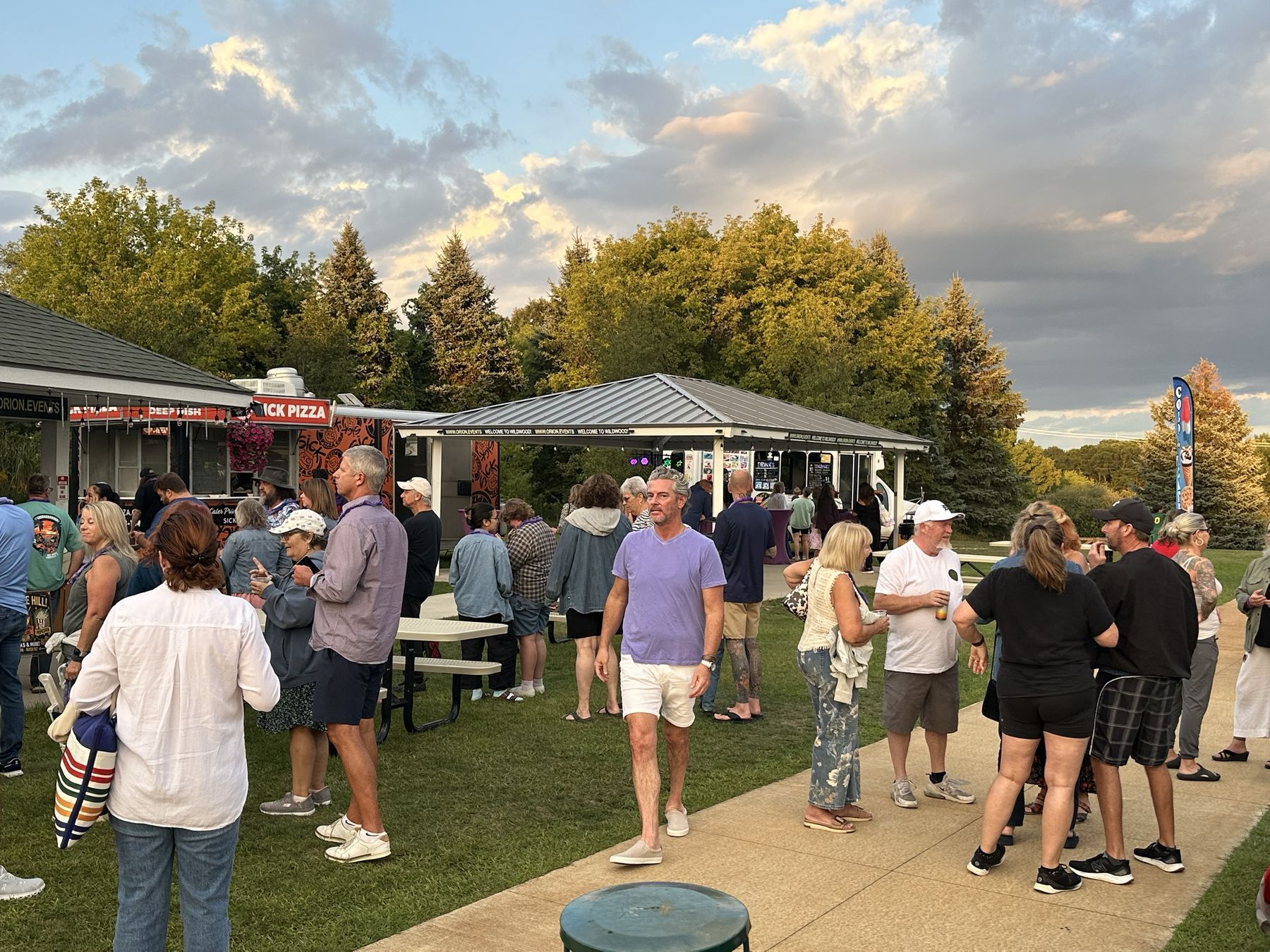 Guests on the lawn between the AMP and the Sick Pizza trailer